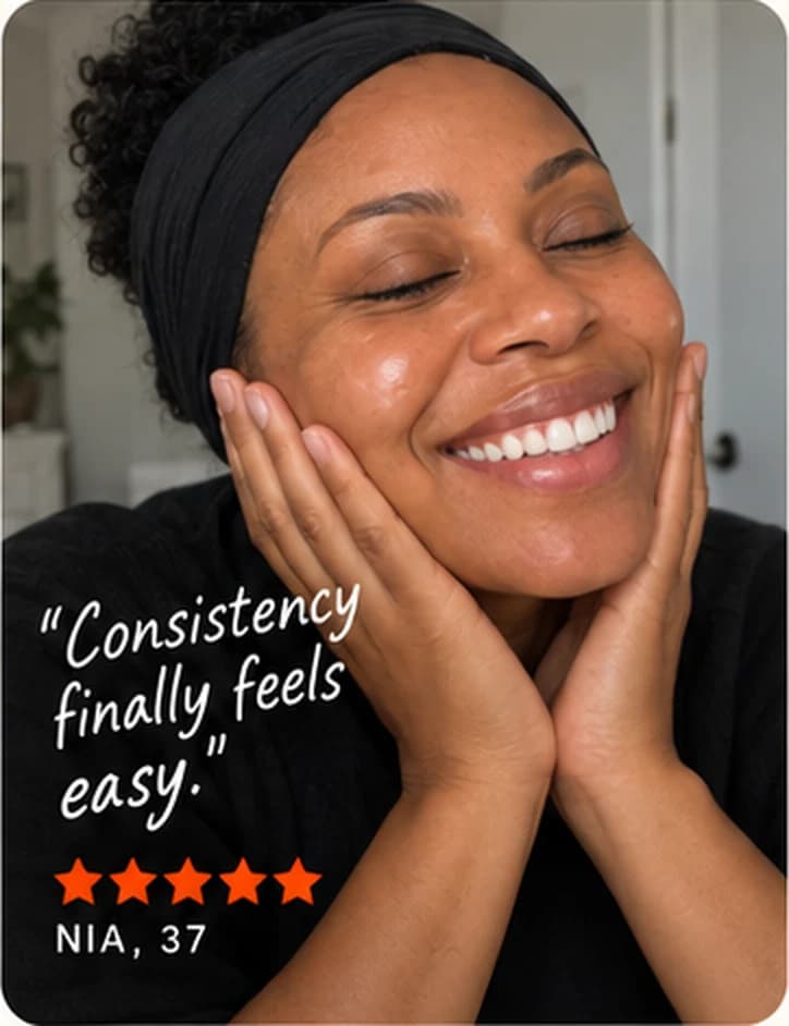 Nia, 37, in a black headband, laughing with her hands on her cheeks.